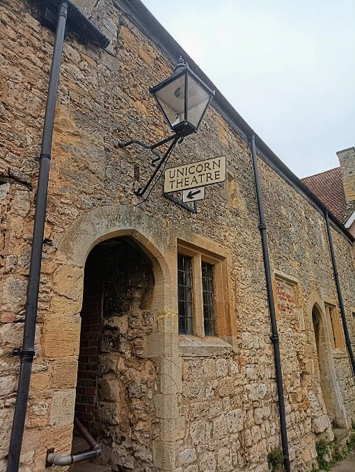 Picure of passage way enterance to the Unicorn Theatre - with sigh that says Unicorn Theatre