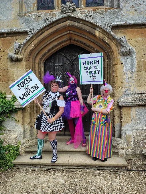 Photo showing three Suffrajesters protesting at Fantasy Forest