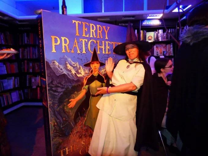 Rachel and a big book Rachel as Tiffany in front of giant book cover of The Shepherd's Crown