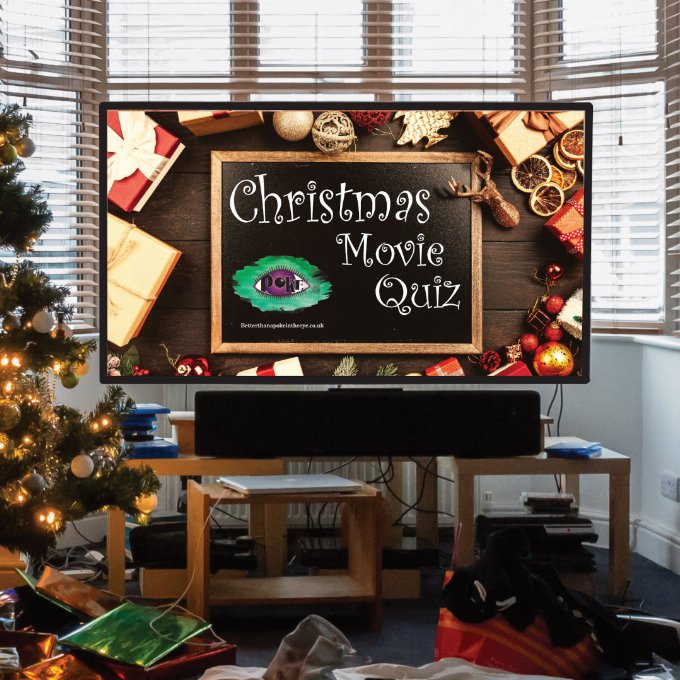 Festive image of a large television set with presents around the floor.  On the screen is the message Christmas Movie Quiz 2023 by Better Than a Poke in the Eye